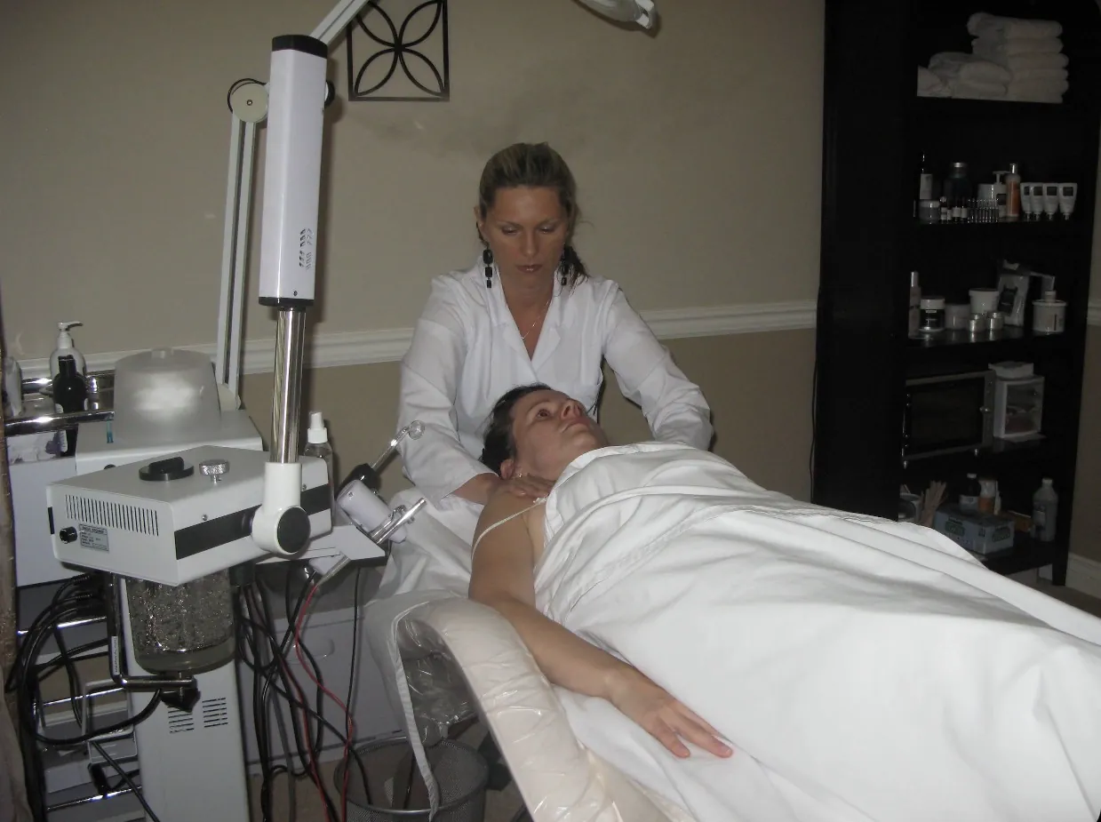 Renata performing a neck and décolleté massage during a European facial at Renton Skin Care